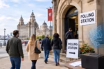 Liverpool residents heading to a polling station near historic city buildings for the 2026 local elections.