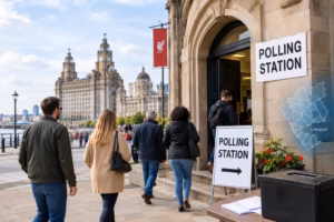 Liverpool residents heading to a polling station near historic city buildings for the 2026 local elections.